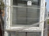 a white and blue refrigerator sitting on a pallet