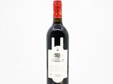 a bottle of wine that is sitting on a table