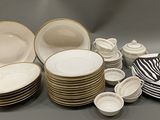 a lot of plates and bowls with zebras on them