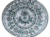 an image of a blue and white plate with a design on it