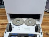 a white printer sitting on top of a wooden table