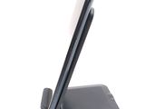 a cell phone that is sitting on top of a stand