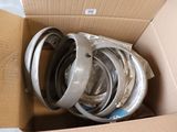 a cardboard box with a bunch of different types of belts in it