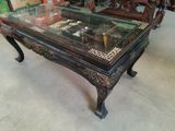 a coffee table with a glass top in a store