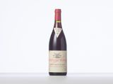 a bottle of wine that is sitting on a table