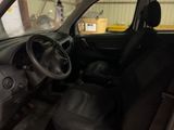 a car that is inside of a building with the door open