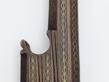 a very old dagger hanging on the wall