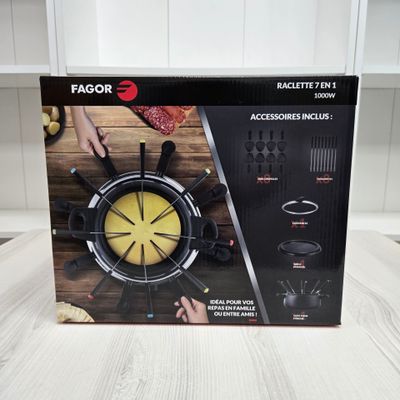 a box with a clock inside of it on a table