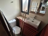 a toilet and a sink in a small room