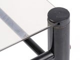 a close up of a glass table with a metal frame