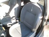 the interior of a car with two seats and a steering wheel