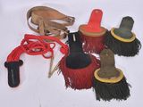 a lot of different types of brooms that are on the floor