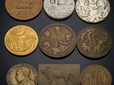 a group of six coins with different designs on them