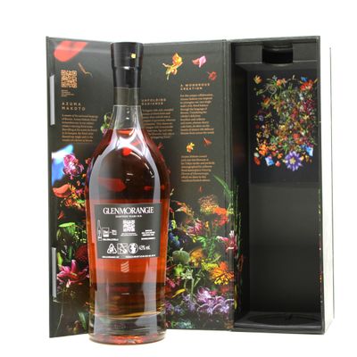 a bottle of whisky with a floral design on the front