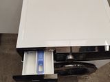 a white table with a drawer that has a toothbrush in it