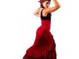 woman in a red flamenco dress is posing for a picture