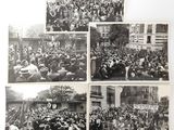 several black and white photos of a crowd of people in a city
