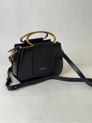 a black handbag with a gold handle on a white background