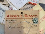 a pile of old letters and envelopes on the floor