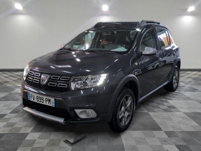 a picture of a grey dacia parked in a garage