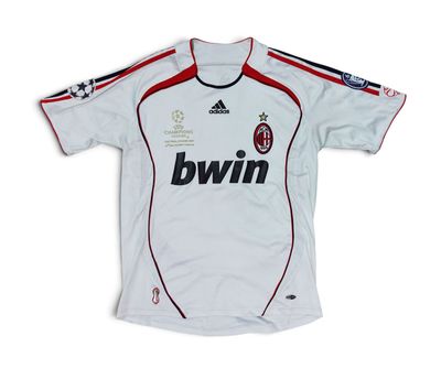 a white shirt with a black and red stripe on the chest