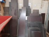 many pieces of metal in a room with a red table