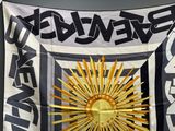 a black and white flag with a sun on it