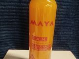 a bottle of orange juice sitting on top of a box