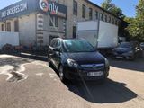 a black car parked in front of a building