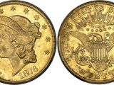 a gold coin with a woman ' s head and eagle on it