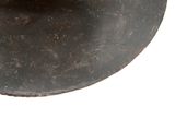an orange that is sitting on top of a black plate