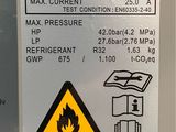 a sign on the side of a water heater stating that it is not hot