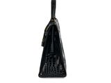 a black purse on a white background