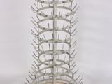 a metal rack that has a bunch of bottles in it