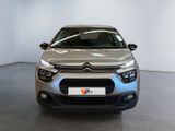 the front of a silver citrole car parked in a showroom