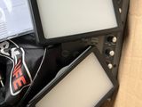 a box full of electronic equipment and a bag