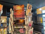 a display of postcards on a rack in a book store