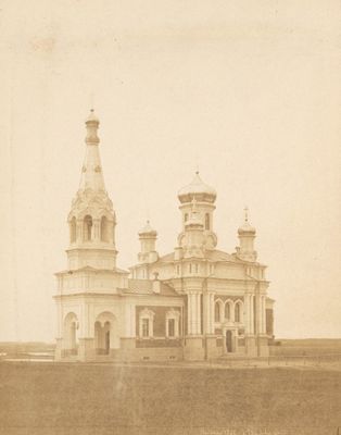 an old photo of a church in the middle of a field