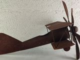 a small toy airplane that is sitting on a table