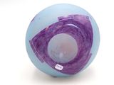 a glass ball with a purple and white design on it