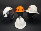 three different types of hard hats on display on a black background