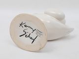 an image of a close up of a white vase with a black writing on it
