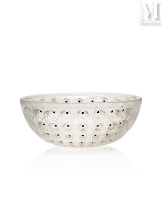 the bowl is made of glass and has holes in it
