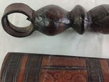 a wooden handle and a wooden case on a table