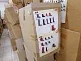 many boxes stacked on top of each other with shoes on them