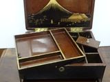 a wooden box that has a drawer in it on a table