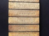 a close up of a piece of wood with writing on it