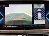 a picture of a car ' s rear view mirror with a car ' s camera attached to it