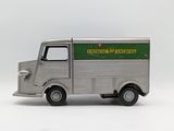 a toy truck that is sitting on a white surface
