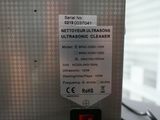 a label on the back of a machine that says ultrasonic cleaner